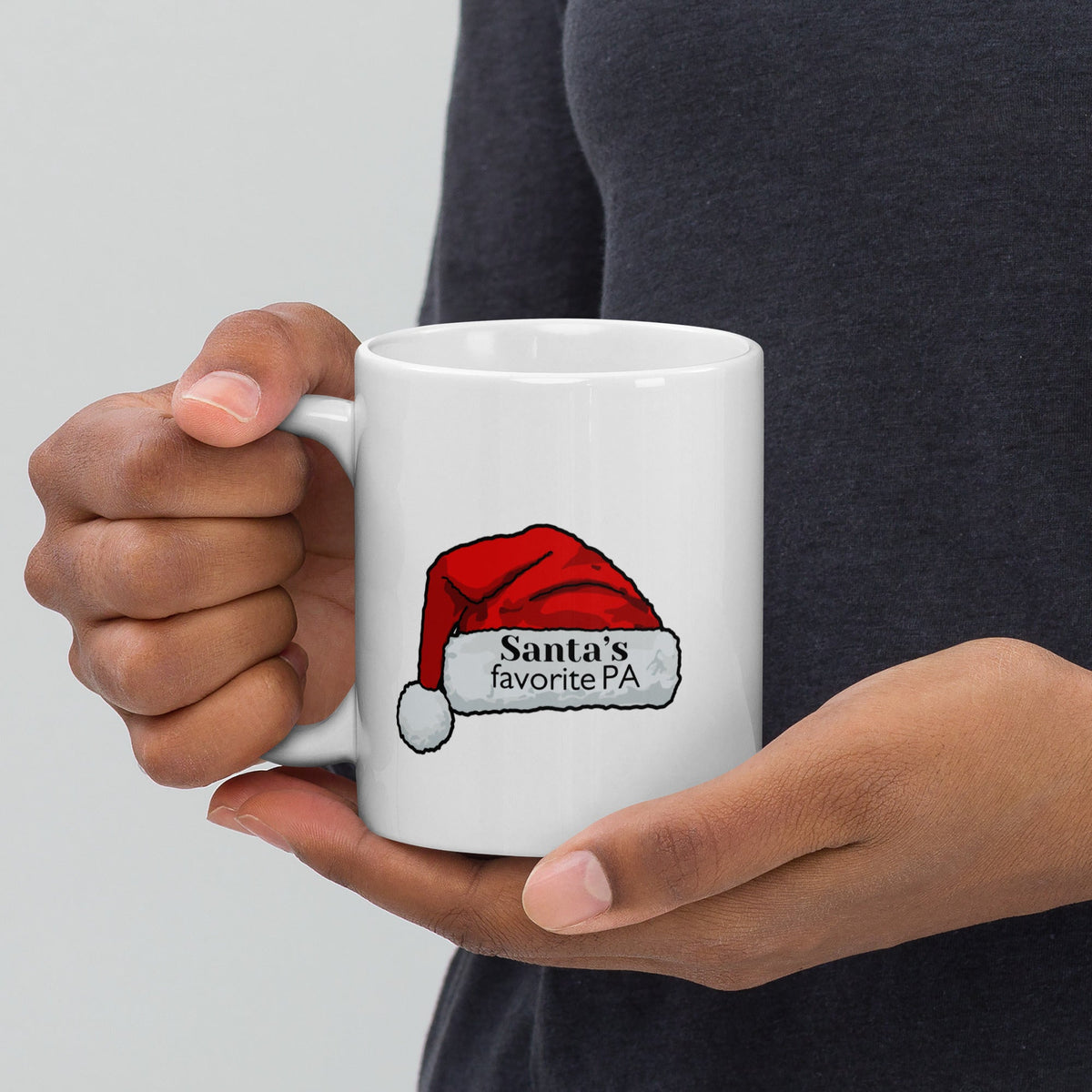 White glossy mug with “Santa’s Favorite PA” Santa hat graphic, left view